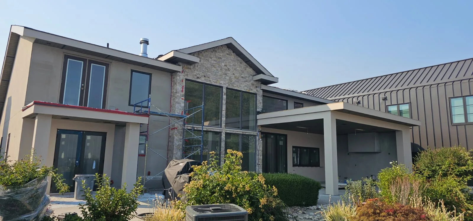 Finished stucco and stone gable on a rear elevation.